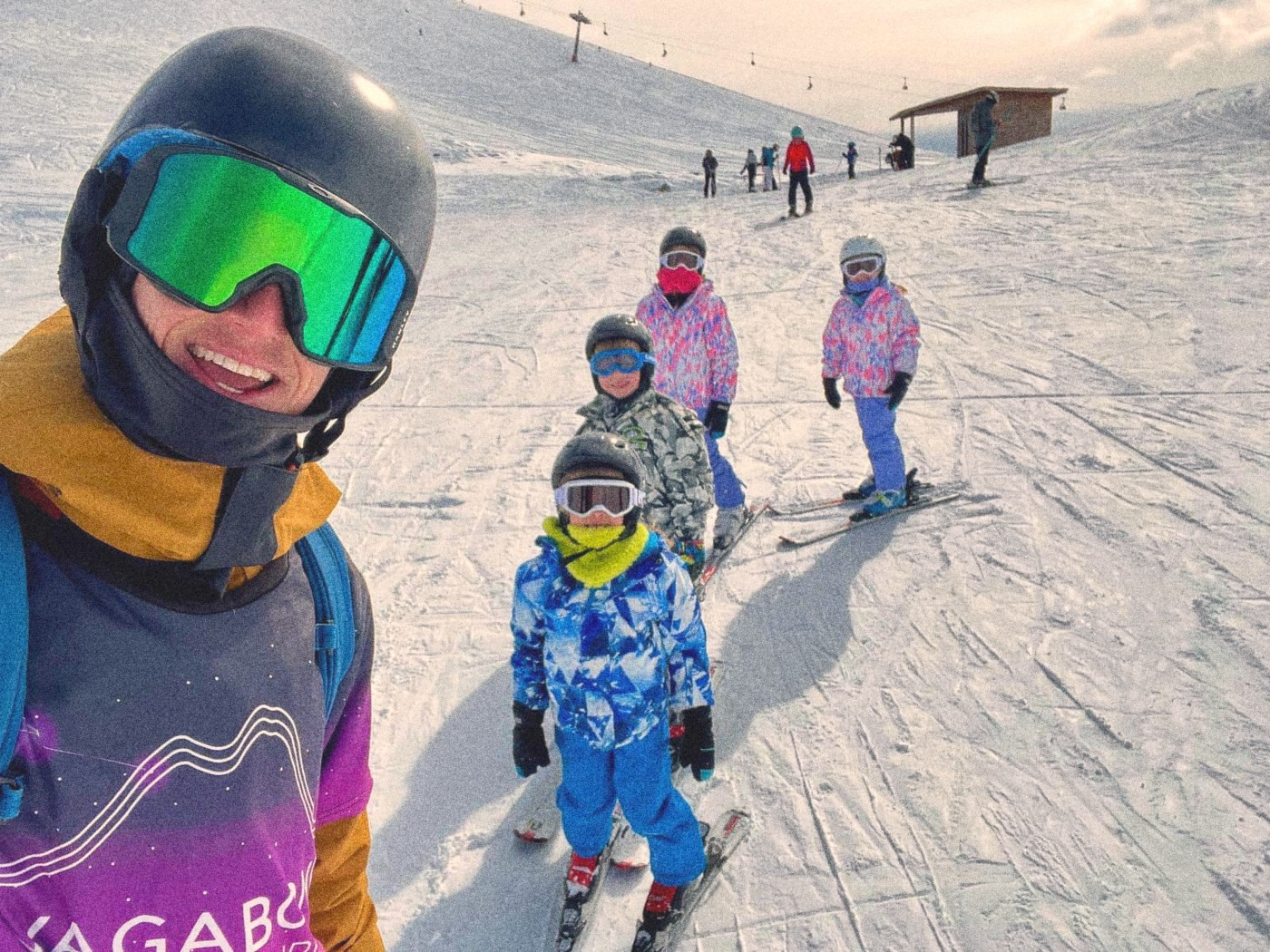 Vagabond Ski School instructor with a group of kids on the slopes in Gudauri